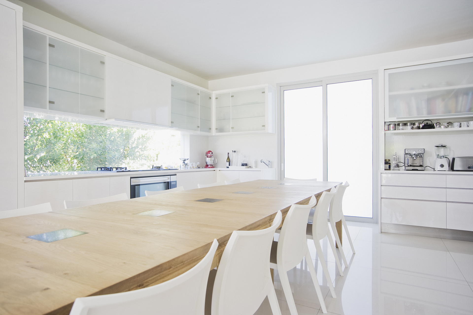 Modern White Kitchen with Extended Dining Table